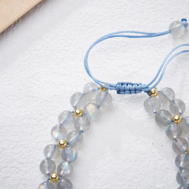 Grey moonstone woven bracelet for women with geometric design and butterfly detailing