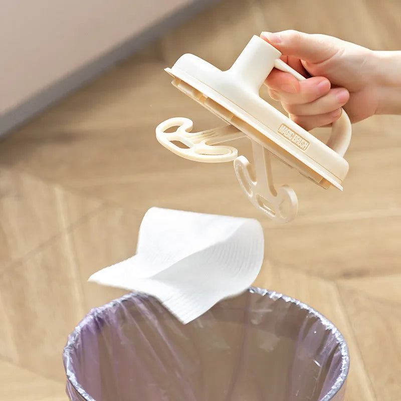 Magic Brush disposable cleaning tool with plastic handle, storage box, and 50 white non-woven fabric rag refills.