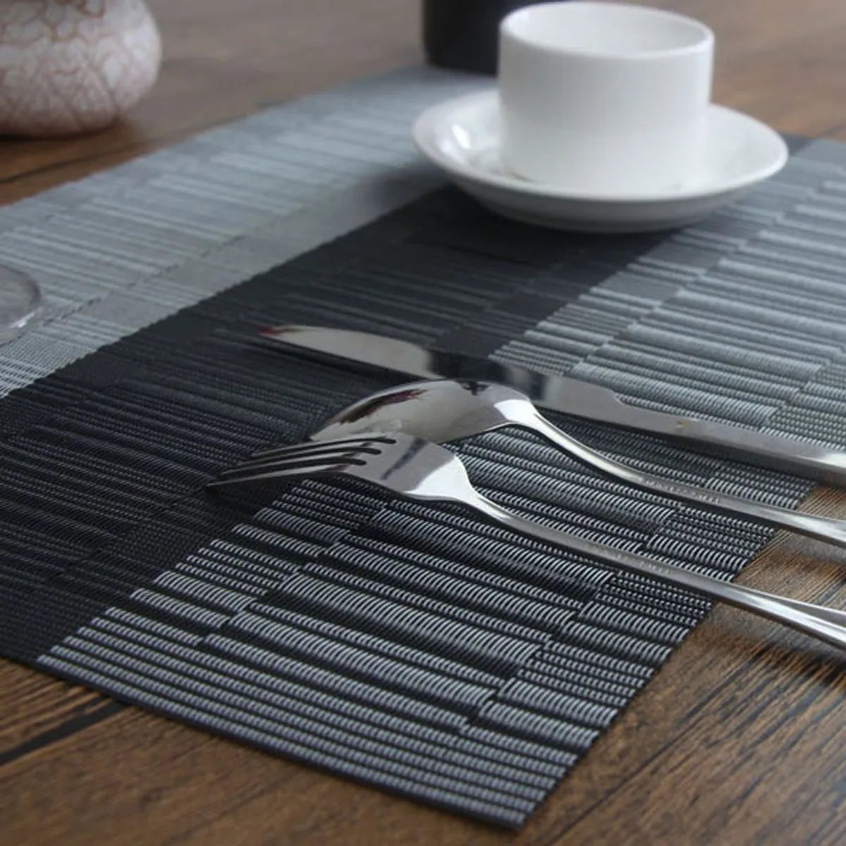 PVC non-slip kitchen placemat in gradient bamboo black colour, shown in 30x180cm size on a counter.