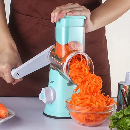 Blue round manual mandoline kitchen slicer with stainless steel blade on a countertop.