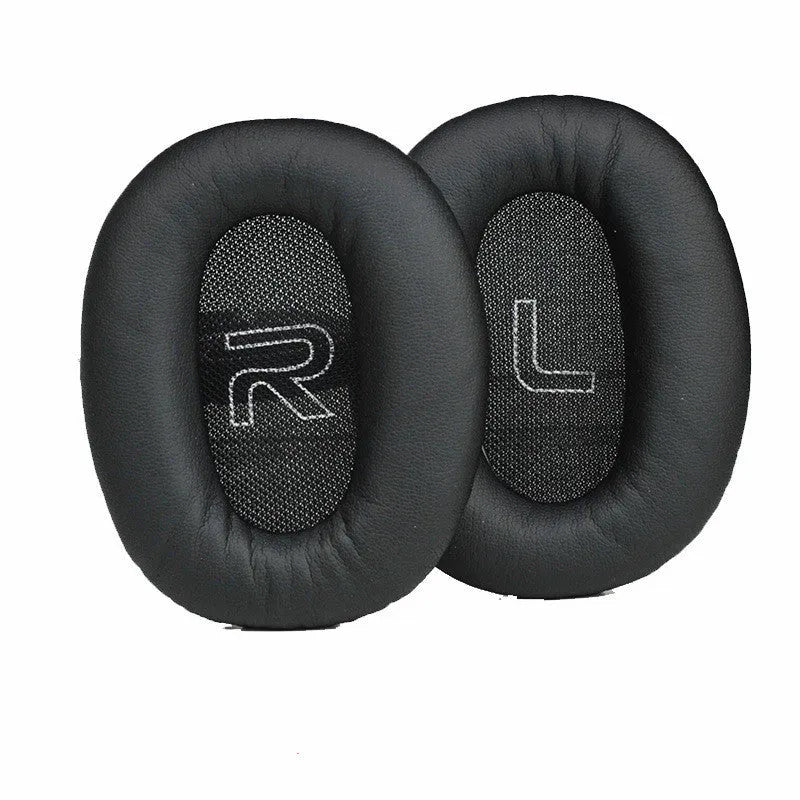 Black protein skin oval earphone sleeves for Walker W820BT headphones on a surface