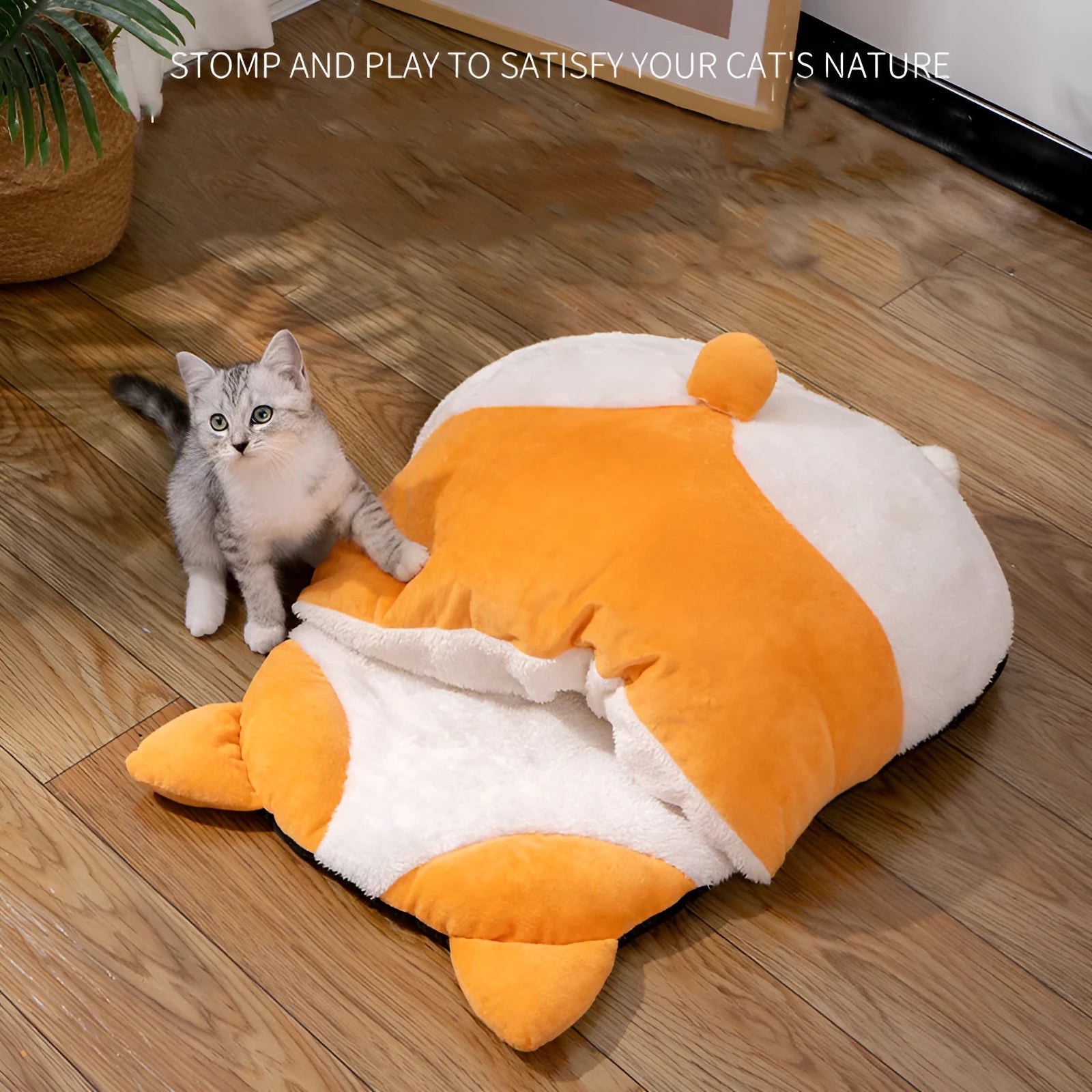 Orange semi-closed cat sleeping bag bed measuring 65cm by 53cm.