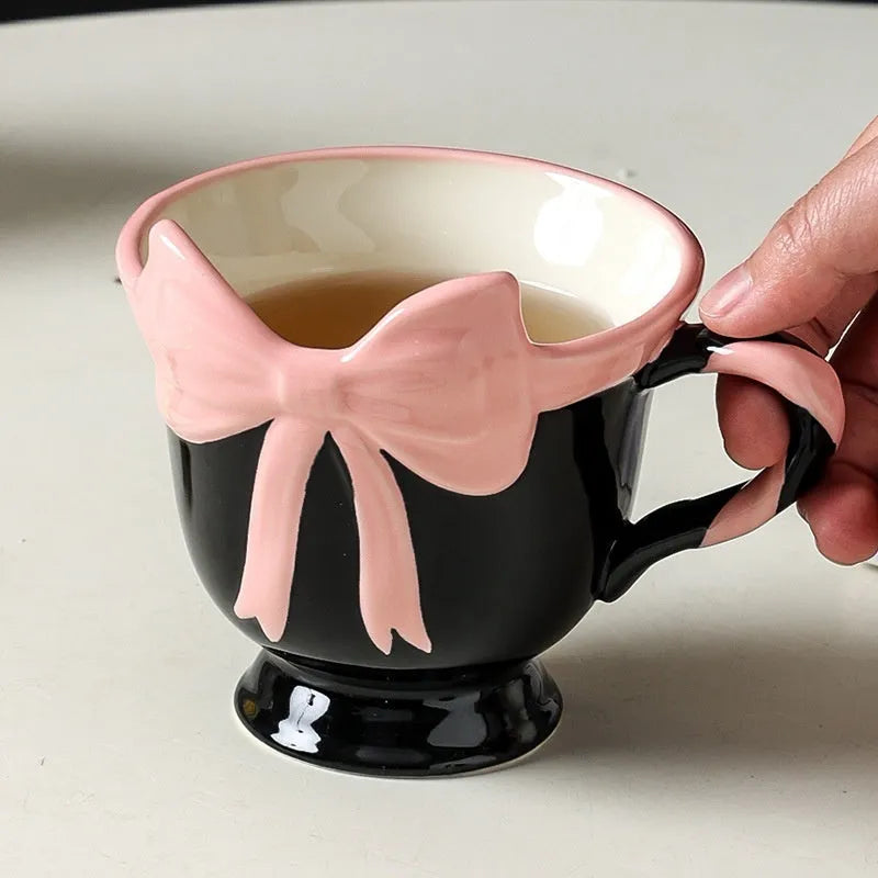 Ceramic mug with girl heart bow design in black pink or white powder colours, 301-400ml capacity