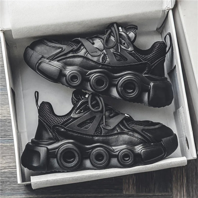 Men's low-top sneakers in black with breathable mesh upper, thick rubber sole, and round toe lace-up design.