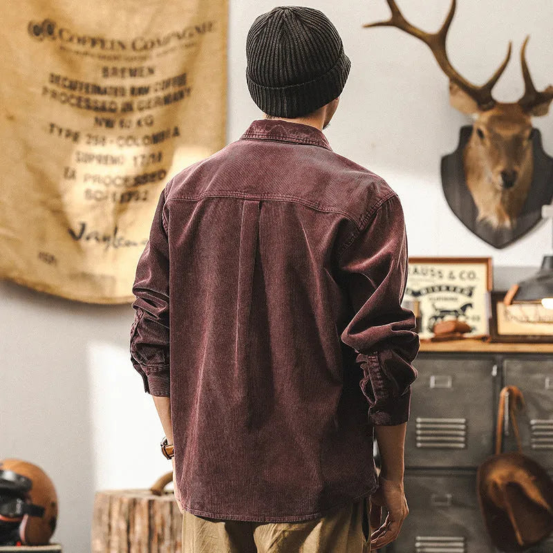 Men's loose-fit corduroy shirt jacket in red or black, showing long sleeves and button front.