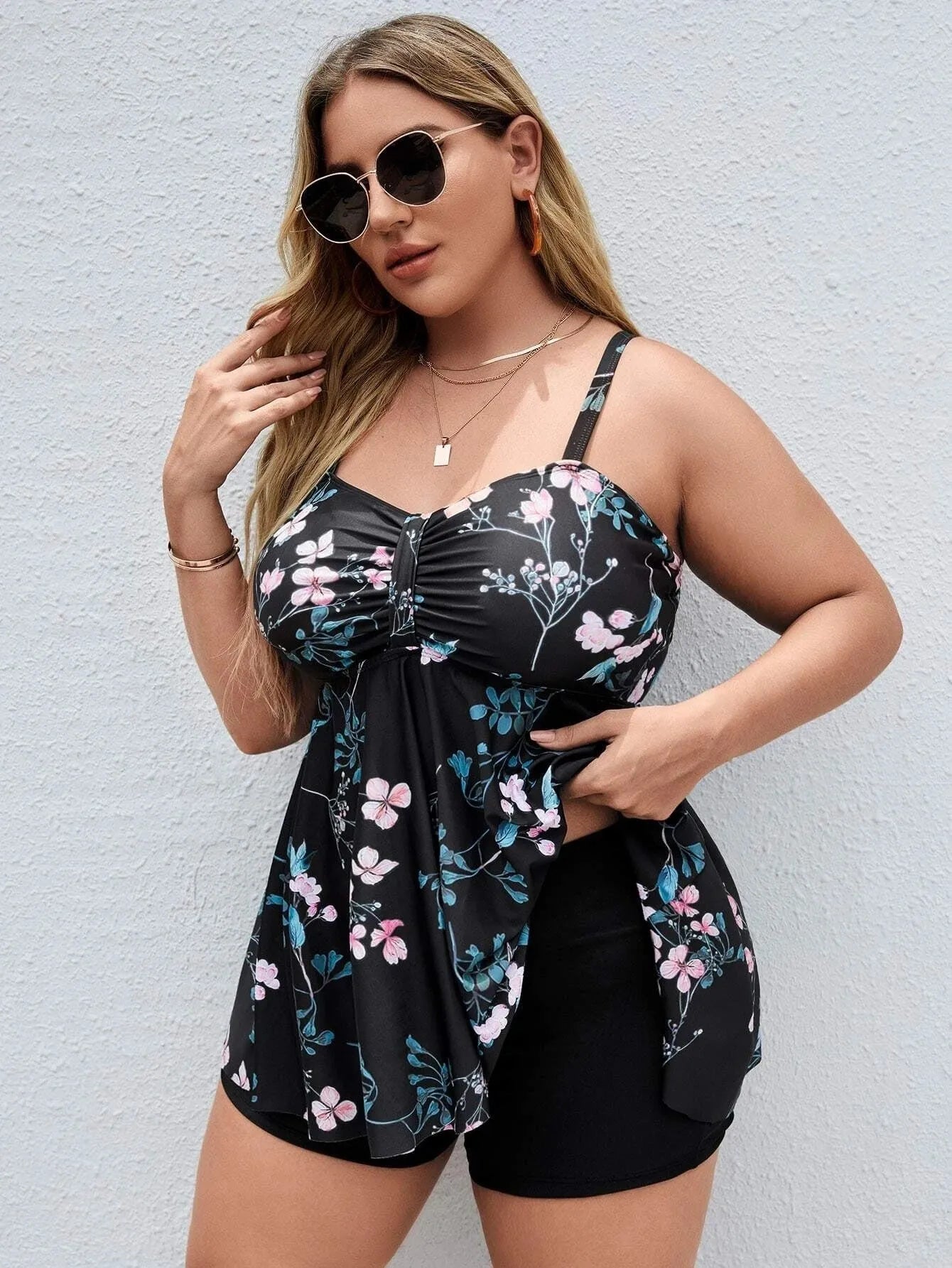 Women's one-piece swimsuit with a split colour floral print pattern on high elasticity polyester fabric.