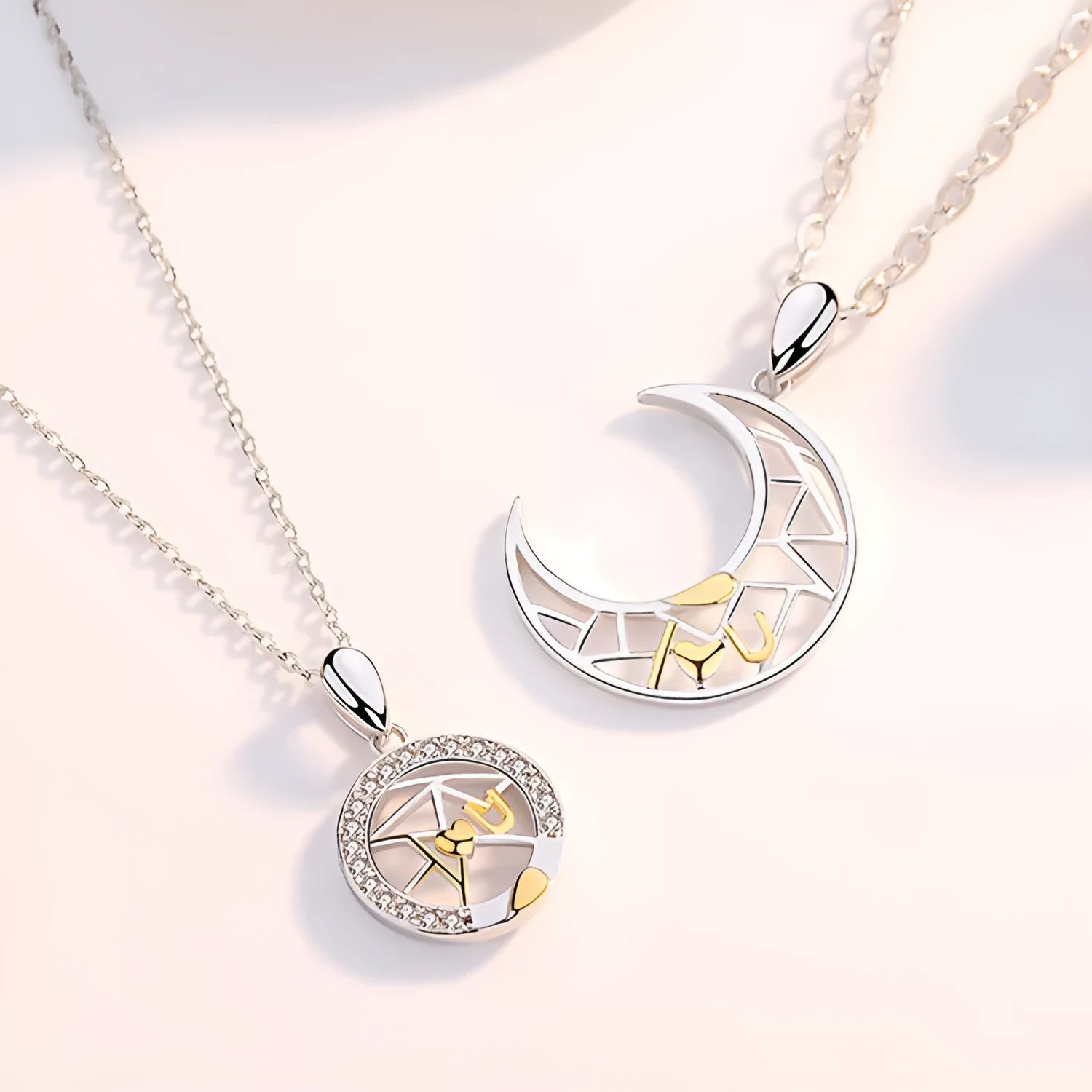 Copper sun and moon couple necklace with electroplated finish and cross chain.