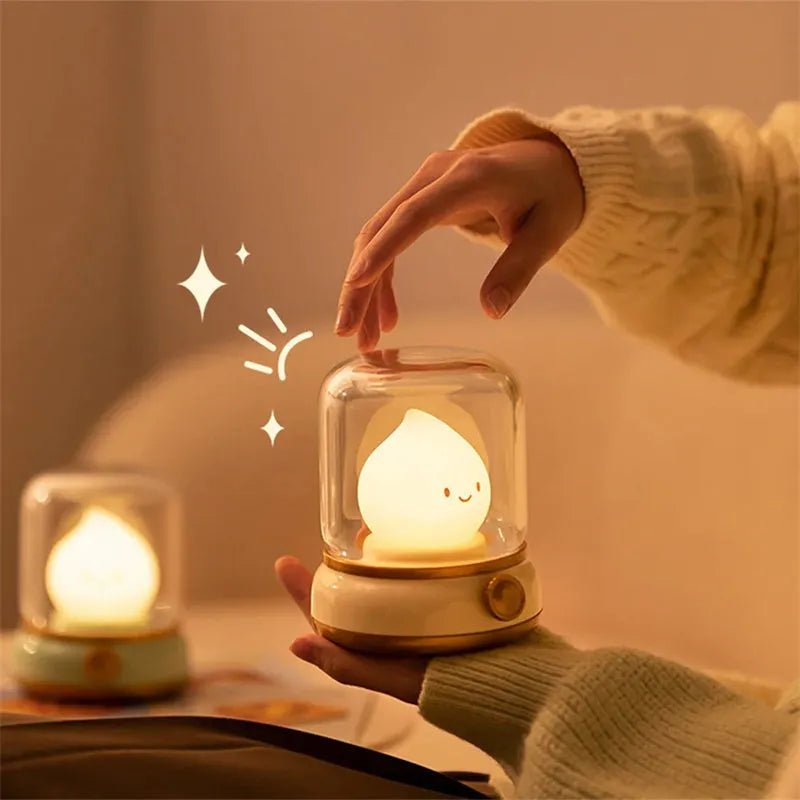 Green retro oil lamp design USB rechargeable LED desk night light on a wooden table.