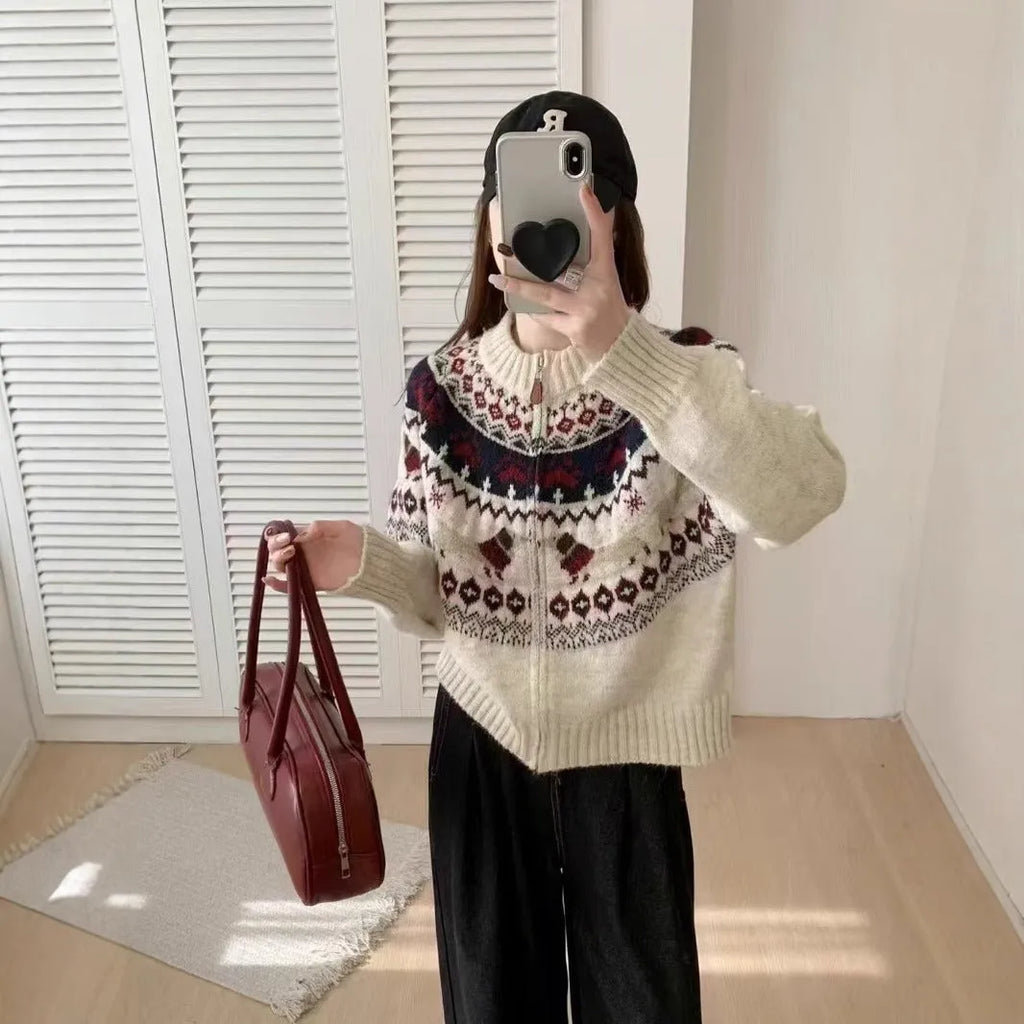 Ethnic style jacquard pullover sweater with 3D pattern in apricot colour, showing loose fit and long sleeves.