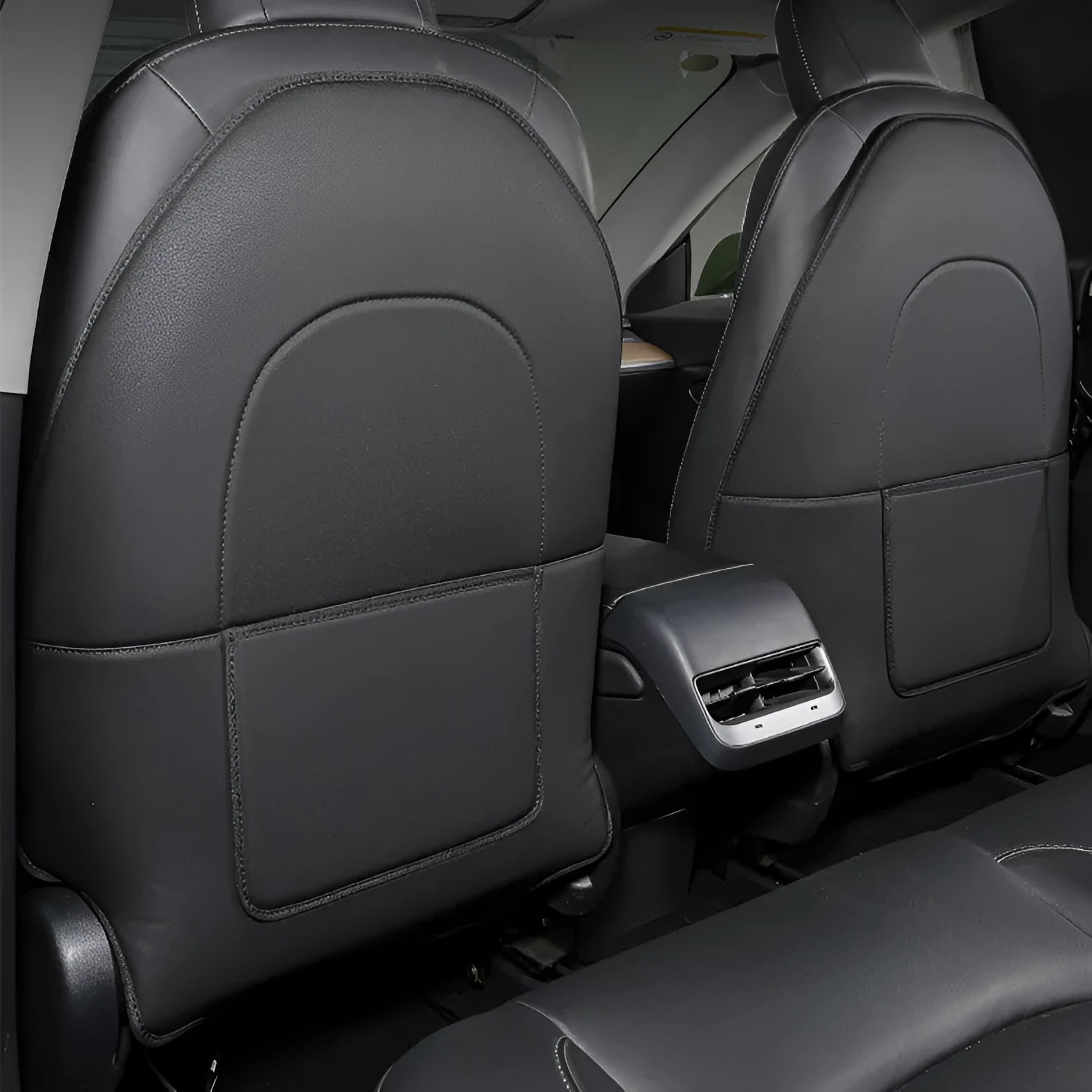 Black leather rear anti kick pads for car seat protection measuring 68cm by 42cm