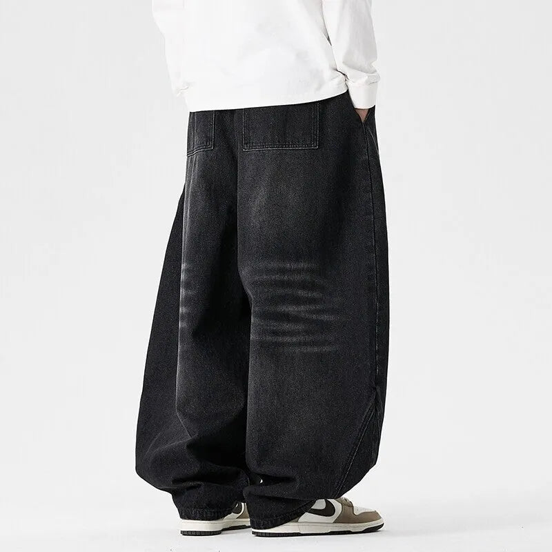 Men's plus size light blue wide leg baggy jeans on a hanger