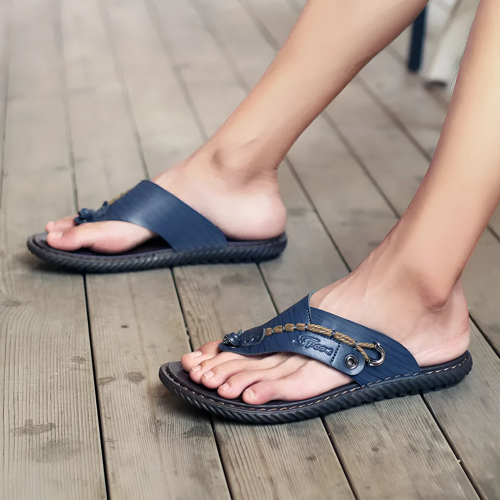 Men's black PU leather casual slippers with non-slip sole on a plain background