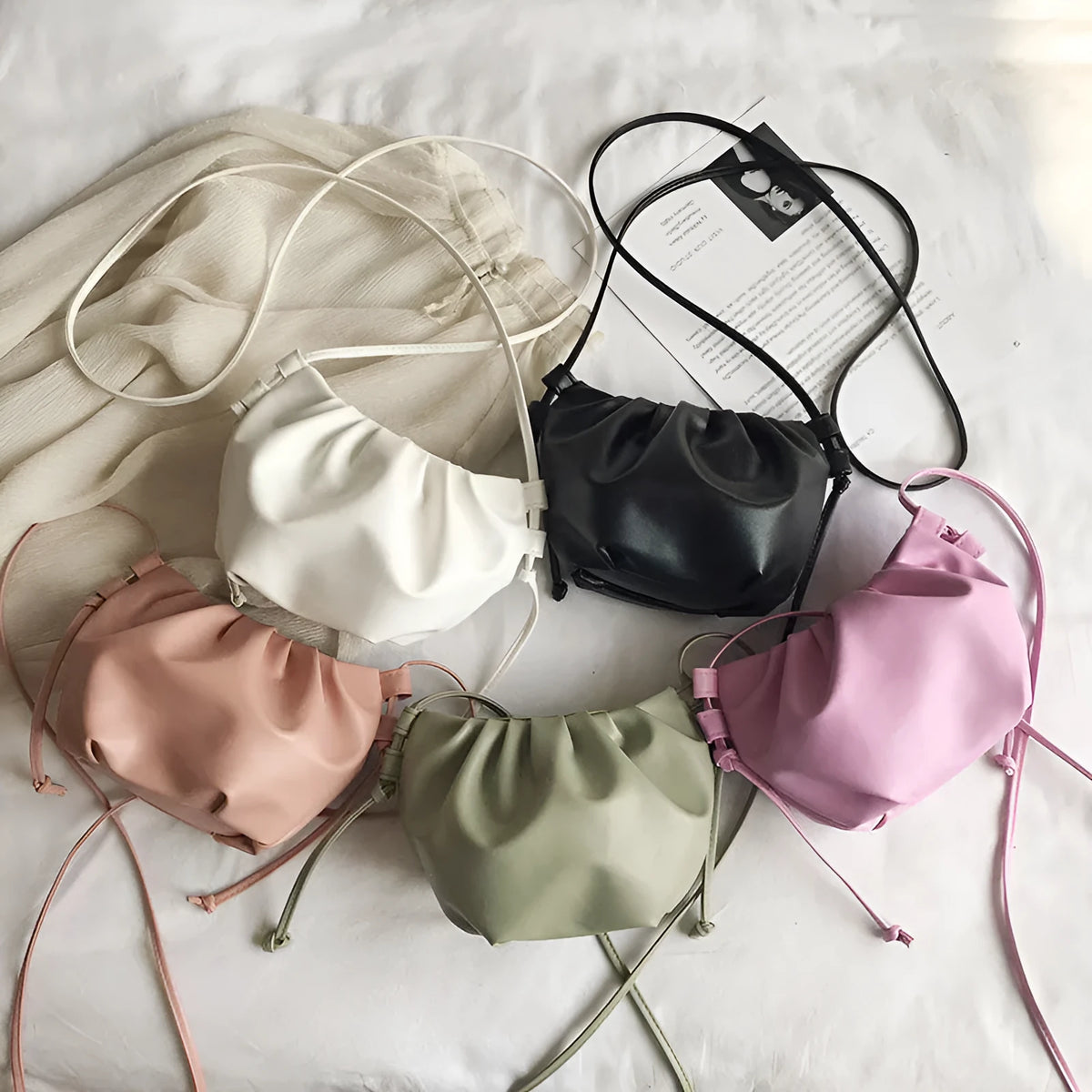 Soft PU Korean-style cloud crossbody bag with dumpling shape, pleated detail, phone pocket, and six colour options