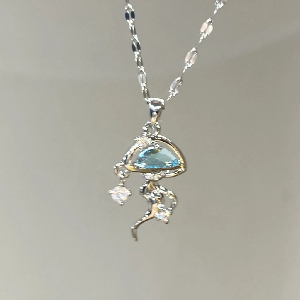 Blue jellyfish pendant necklace on adjustable sterling silver chain with white gold plating