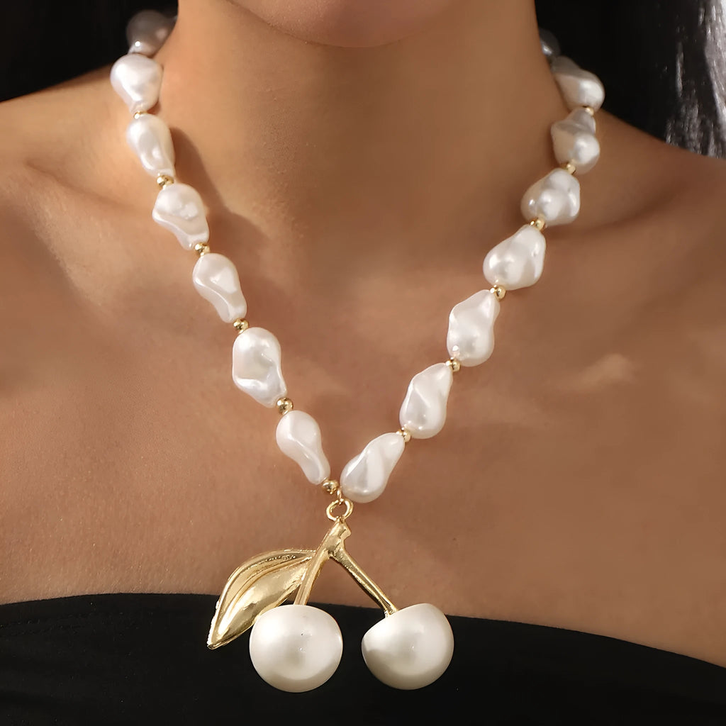 Women's adjustable geometric fruit pendant necklace on a pearl chain in gold or white K.