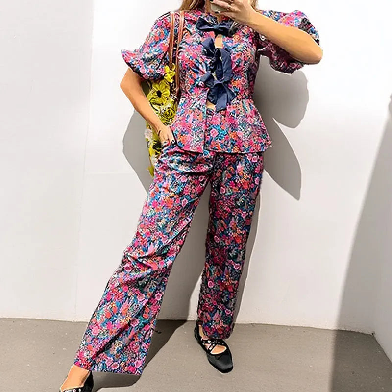 Women's floral print trouser suit set with puff sleeve blouse and matching trousers