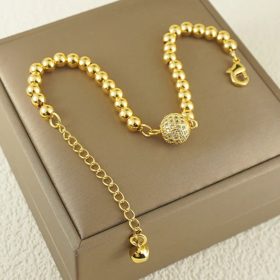 Heart-shaped copper bracelet with round zircon stones in an Arabic style.