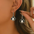 A pair of retro-style creative women's earrings in silver-colour alloy.