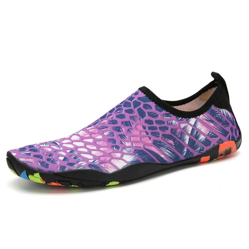 Lycra beach wading shoes with EVA midsole in blue, shown on a sandy shore.