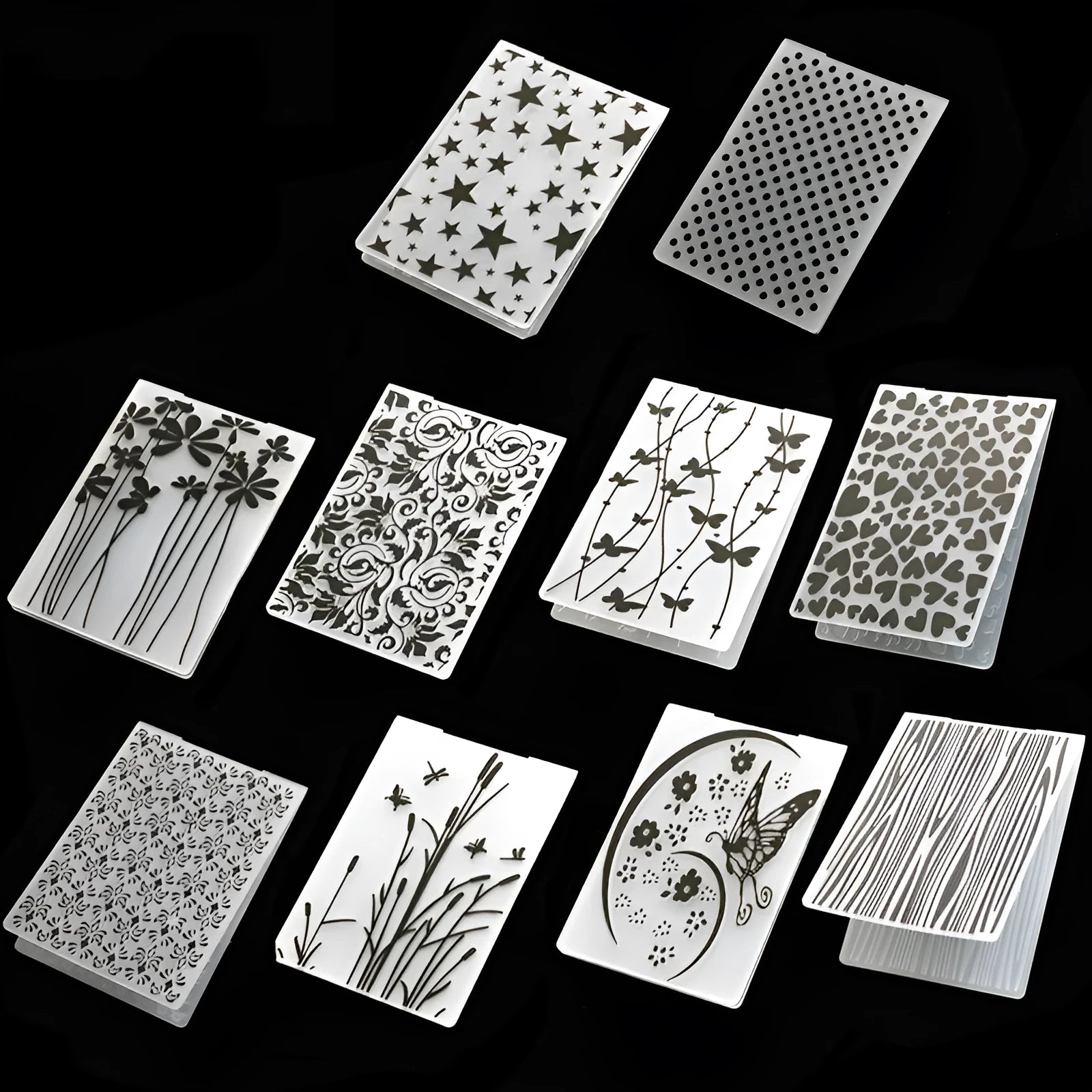 Set of plastic folding cake decorative moulds showing windmill, star, flower and butterfly designs.