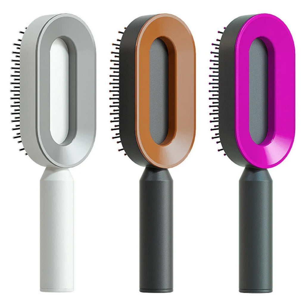 Self-cleaning air cushion hair brush in white, black gold, or black purple with ergonomic handle