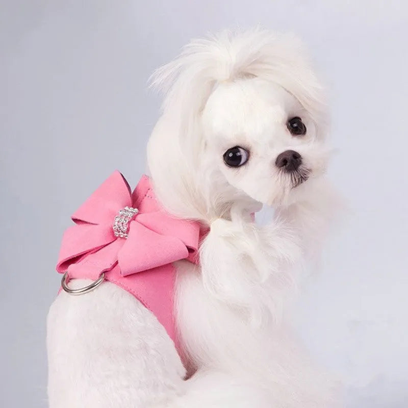 Cute pink puppy harness with a bowknot, made from soft microfiber, shown on a small dog.