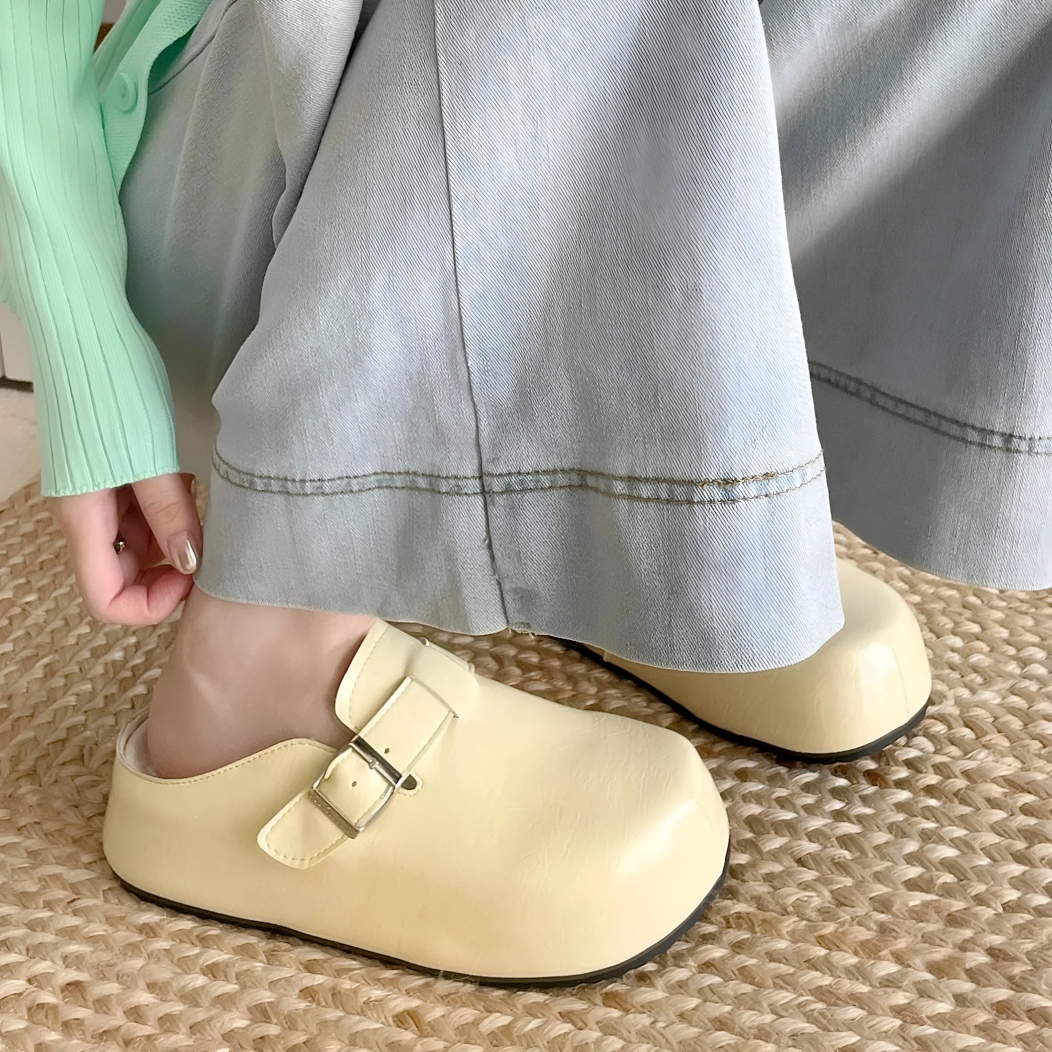 Flat buckle casual sneakers with round toe in yellow, creamy-white, silver, and black colours