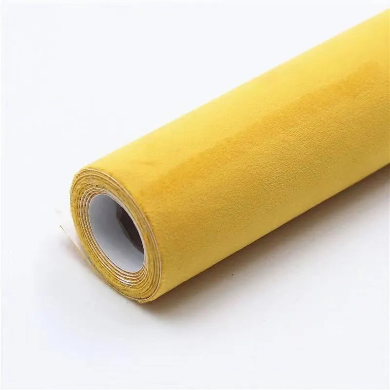 Self-adhesive leather suede sheet in beige colour showing texture and adhesive backing.