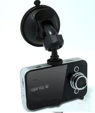 K6000 car dash cam with 120 degree wide angle lens mounted on front windshield in black finish