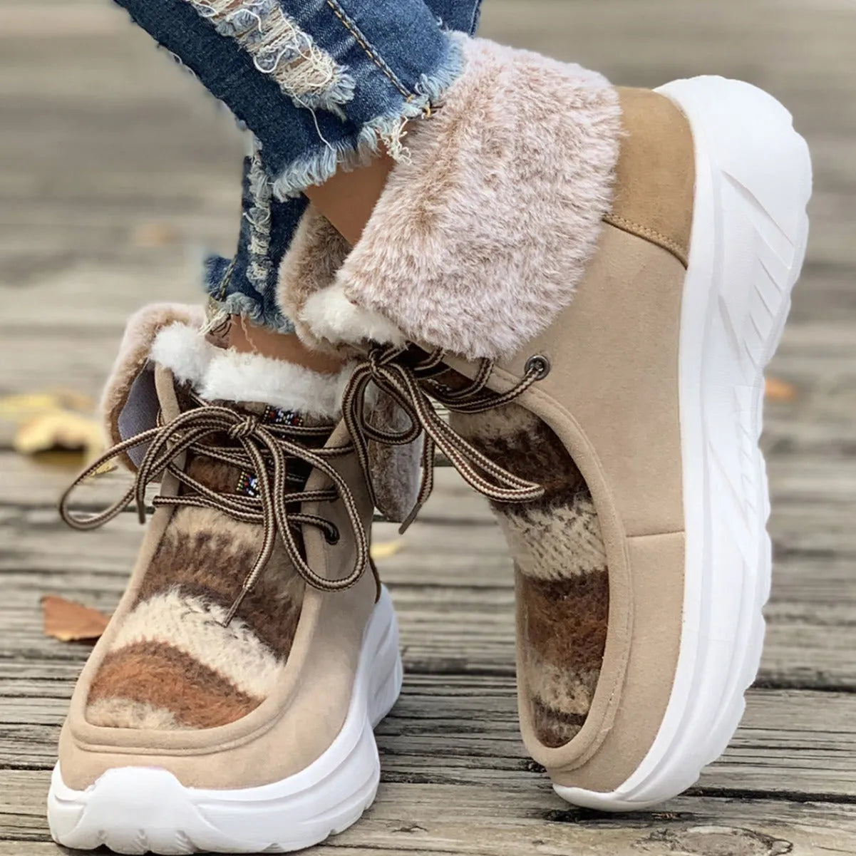 Beige women's lace-up mid-top snow boots with suede upper and thick rubber sole.