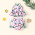 White two-piece baby girl swimsuit set with shirt and shorts for summer beach wear