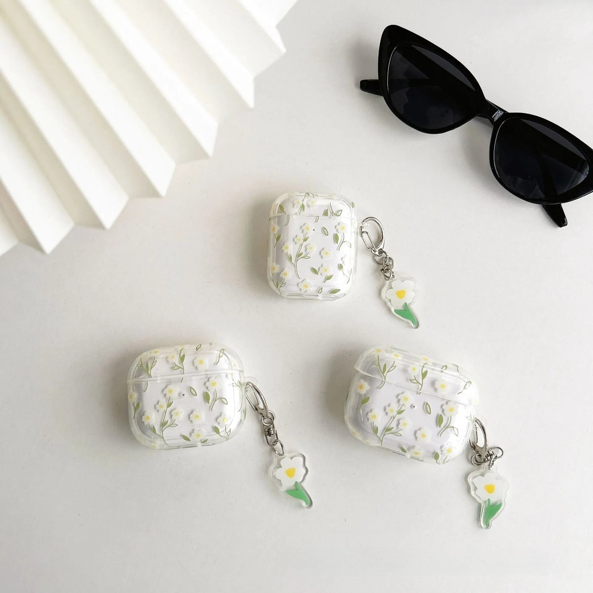 White floral pattern transparent TPU soft cover for Apple AirPods charging case.