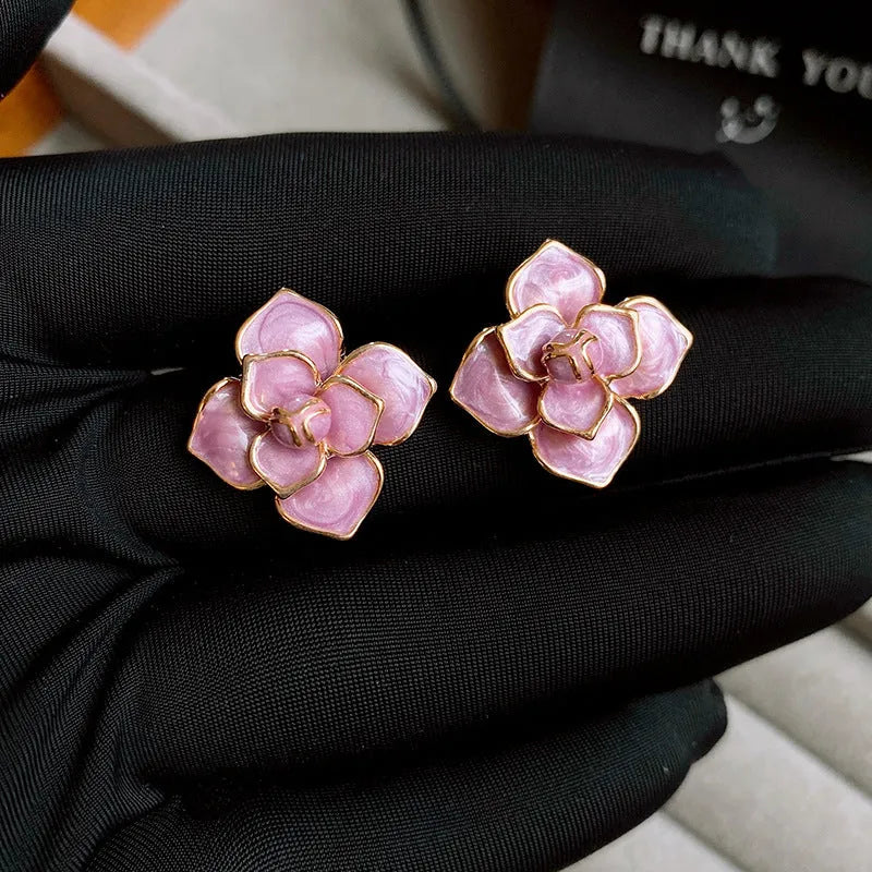 Golden-purple oil-spot glaze flower stud earrings with gold-plated silver needle detail on copper.