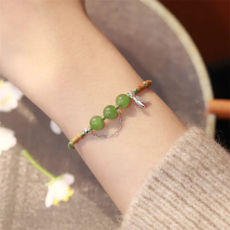 Hetian jade bracelet with diamond weave and lotus design in light green or haze blue