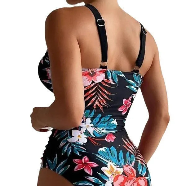 Women's floral print backless one-piece swimsuit on a model, showing the tight fit and stretchy fabric.