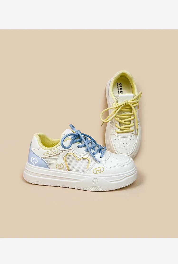 Korean-style white and blue sneakers with mesh cross-straps and lace-up closure for children.