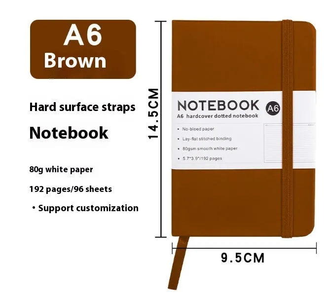 A5 soft touch PU leather strap diary open showing lined pages, closed with elastic band, in a choice of colours.