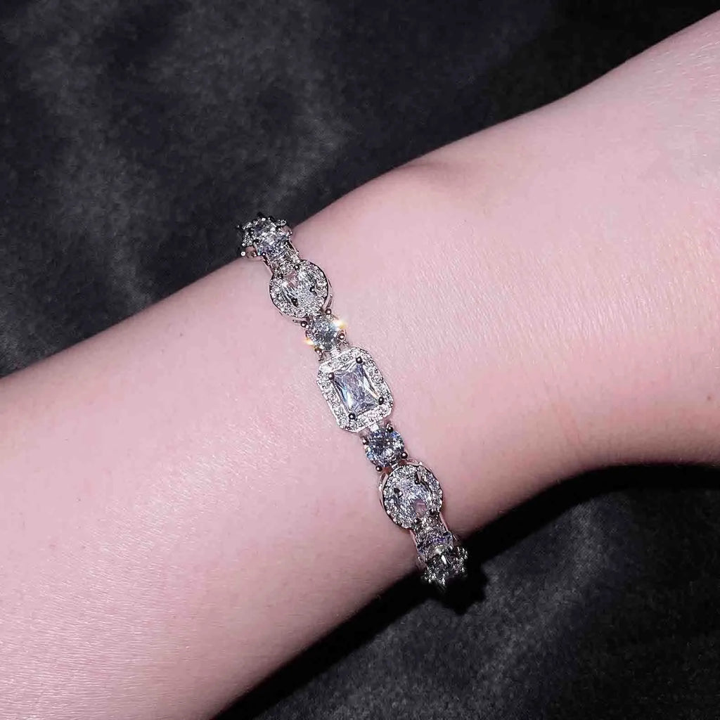 Geometric women's silver bracelet with zircon stones, shown in two length options.
