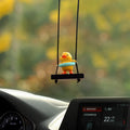 Yellow plastic cartoon duck doll car hanging ornament with a choice of bath towel, swimming ring, bath bucket, or bow pendant.