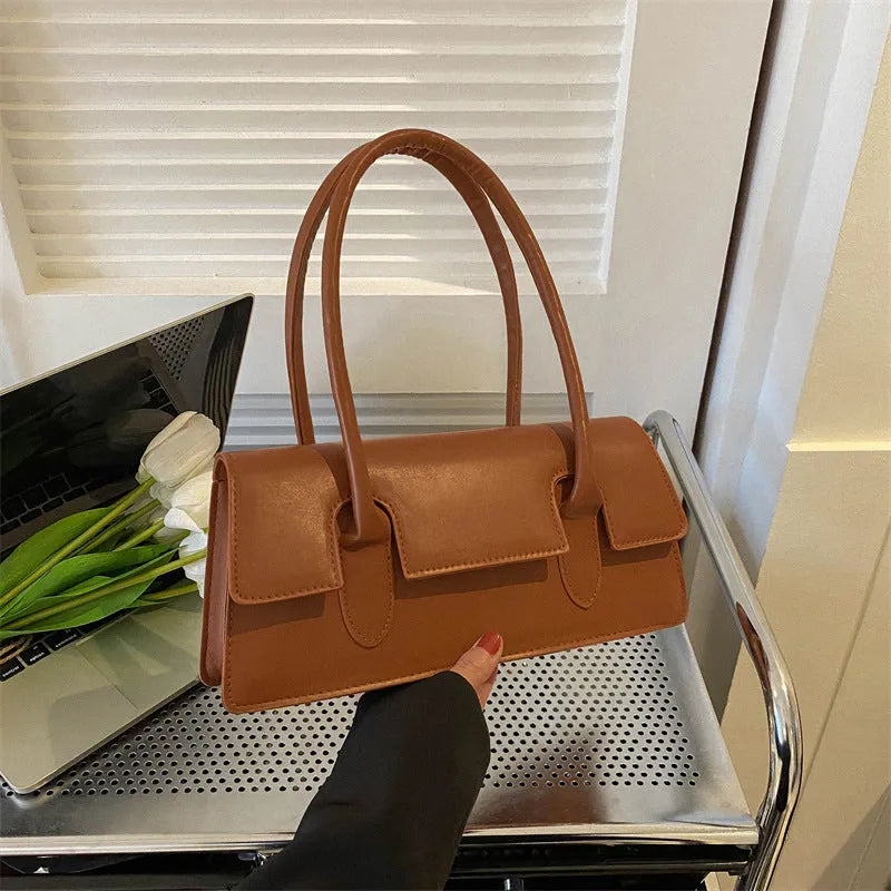 Women's horizontal square PU shoulder bag with stitching detail and single strap in black colour