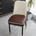 Orange leather horseshoe-shaped seat cushion with non-slip base shown on a wooden chair.