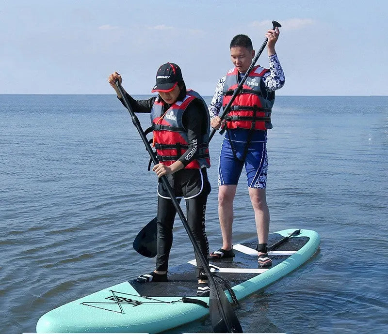 Inflatable stand up paddleboard 320x76cm green PVC with fin and foot rope on water