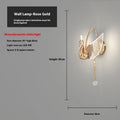 Gold-coloured modern swan-shaped wall lamp with acrylic shade and dimmable multi-colour LED light.