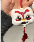 Handmade Chinese lion plush ornament with star stone details on blue and yellow keychain