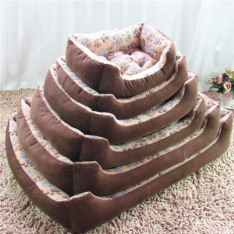 Beige plush dog bed with raised edges and removable cushion for small pets