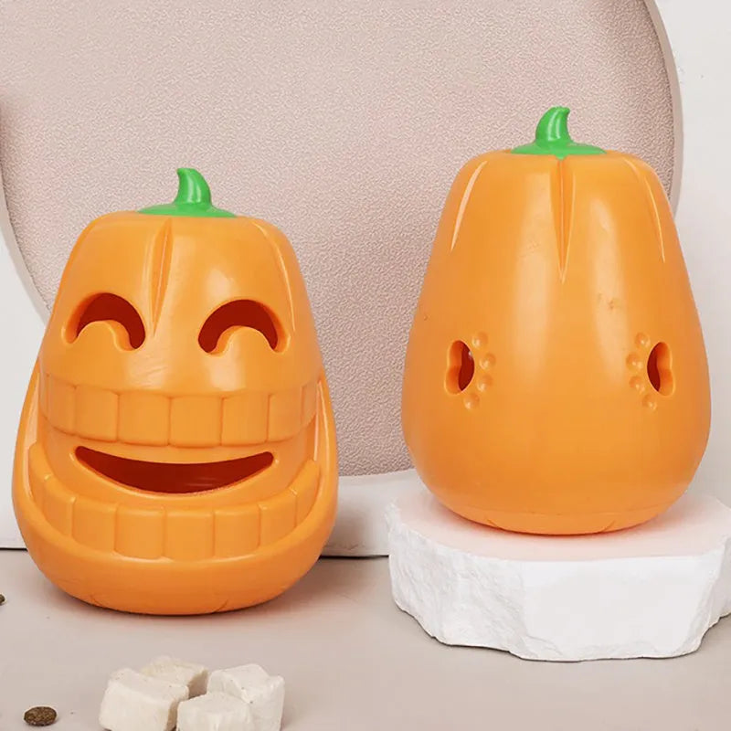 Orange Halloween pumpkin shaped interactive dog chew toy with a treat-dispensing funnel.