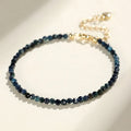 Women's blue tourmaline bracelet with 3mm beads and spacer bead design.