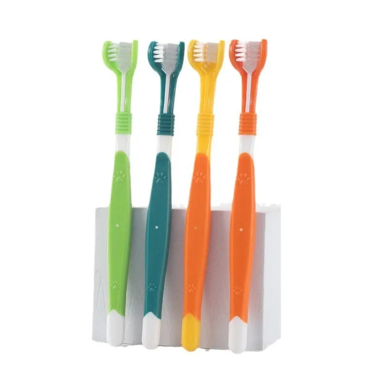 Plastic and nylon pet toothbrush in a sealed bag, colours include orange, green, and blue pink.
