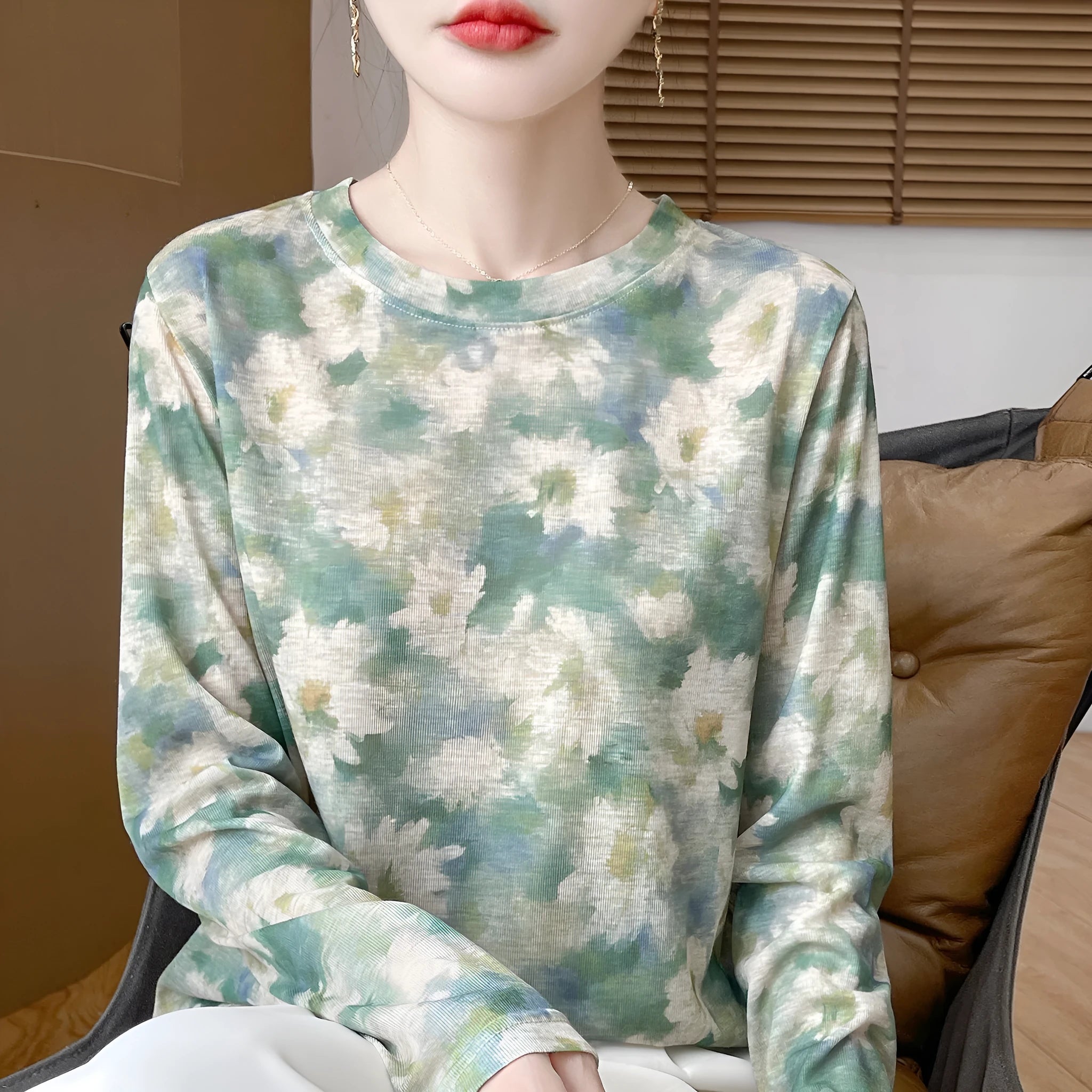 Women's round neck pullover top in a floral print Tencel cotton knitted fabric.
