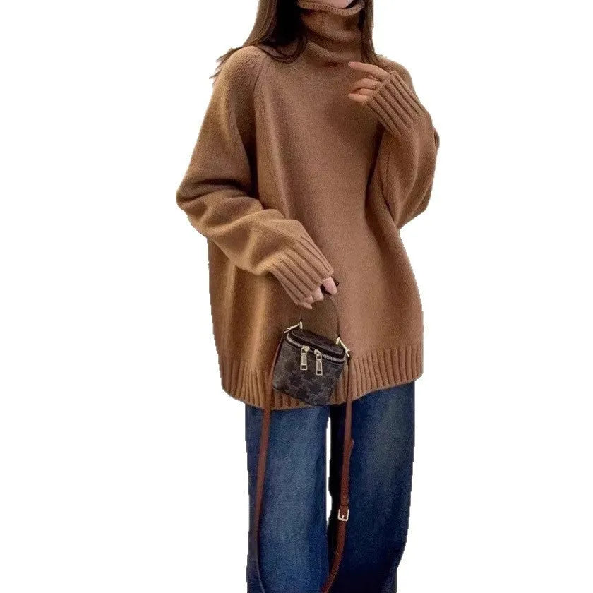 A woman wearing a thick, loose grey turtleneck sweater with a textured curling pile collar.